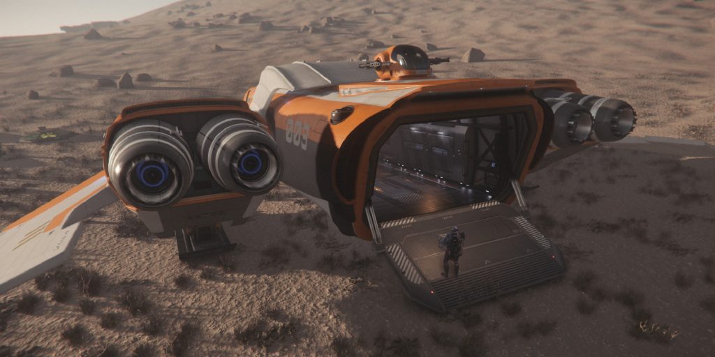 A character carrying a small cargo box into a Freelancer Max in Star Citizen.